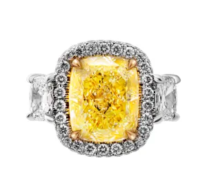 GIA Certified 3 stone ring with 6.31ct Fancy Light Yellow Cushion Cut Diamond