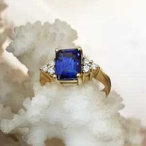 Handcrafted Emerald Cut Tanzanite Ring with Trilogy Diamond Accent