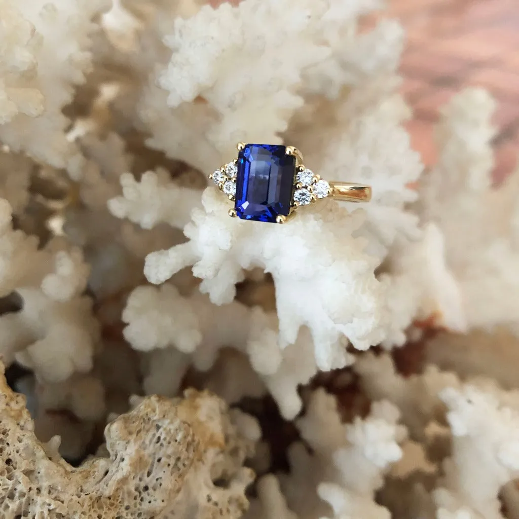 Handcrafted Emerald Cut Tanzanite Ring with Trilogy Diamond Accent