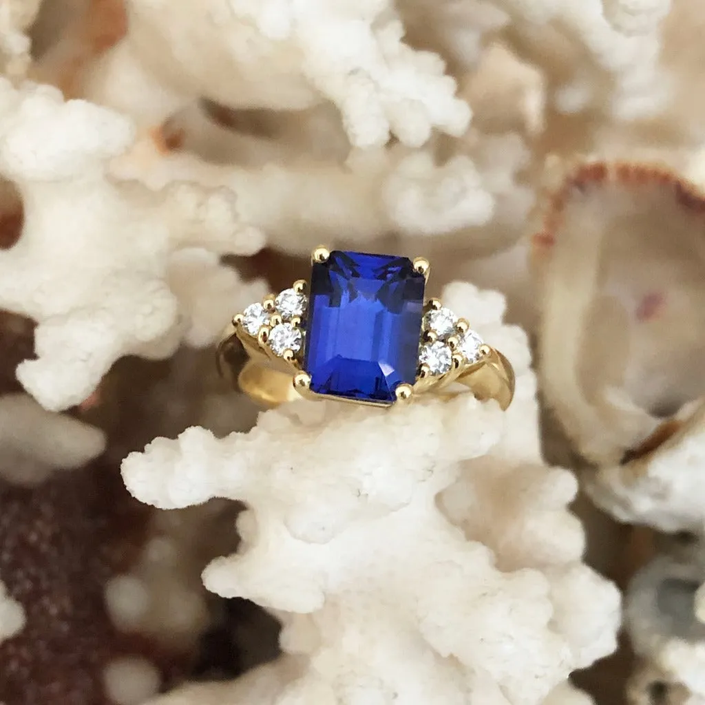 Handcrafted Emerald Cut Tanzanite Ring with Trilogy Diamond Accent