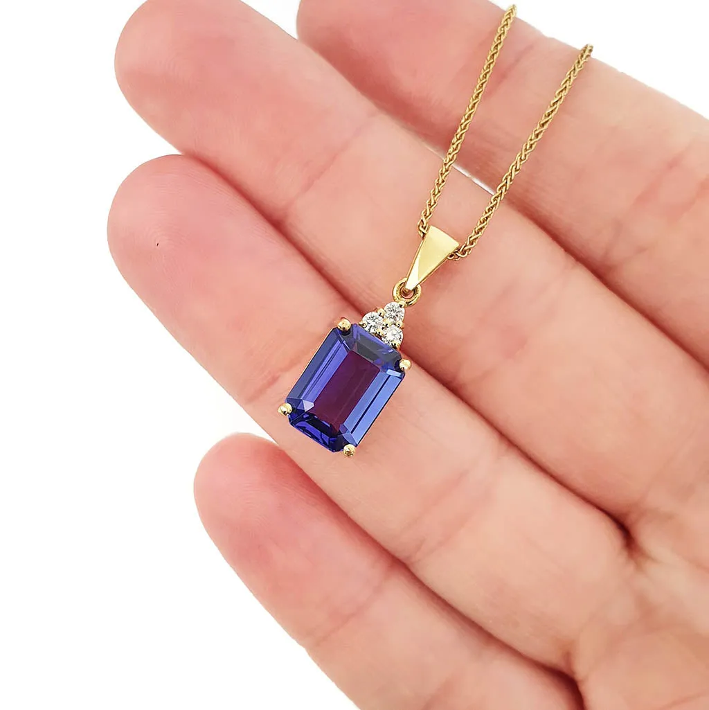 Handcrafted Emerald Cut Tanzanite Yellow Gold Pendant with Diamond Trilogy Detail