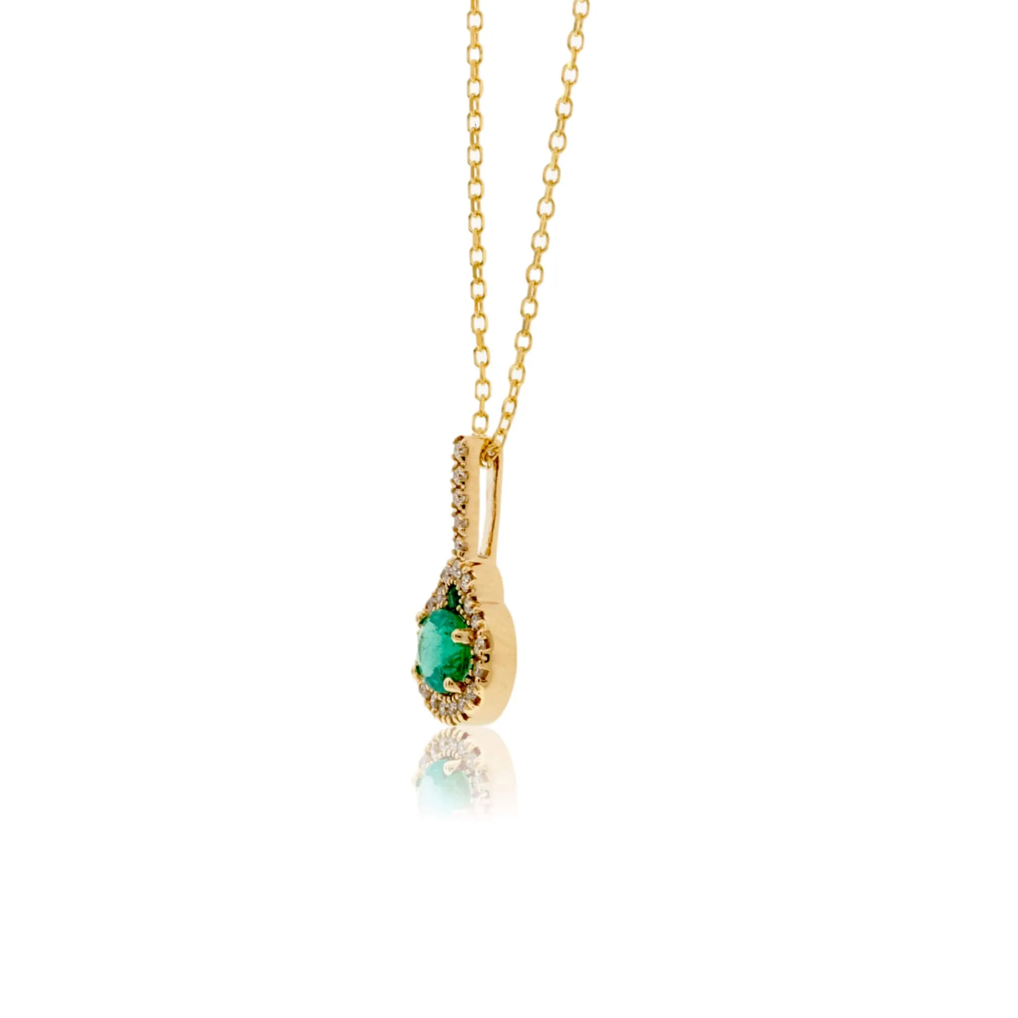 Oval Shaped Emerald Pendant with Diamond Halo